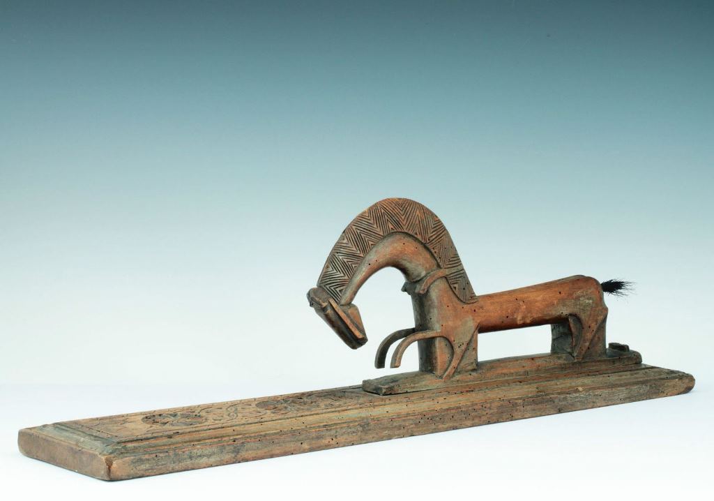 Late 18th-century mangle board from Germany, with a horsehair tip